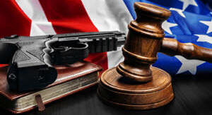 300-gavel-on-wooden-table-with-usa-flag-2025-02-25-18-02-33-utc-300x199